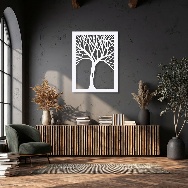 The focal point is the striking white abstract tree silhouette, a piece of modern nature metal art for wall, centrally framed on the dark wall.