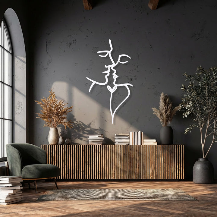 The crisp edges and clean borders of the white abstract face metal decoration wall art are prominently displayed on a dark wall.