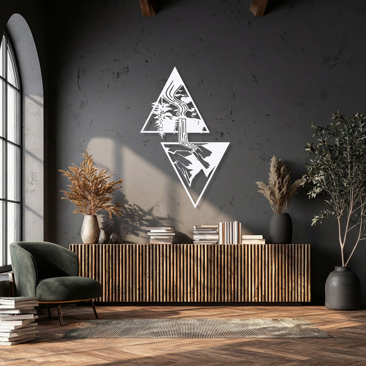 The distinct depth and layered composition of the Geometric Waterfall Escape metal artwork creates an immersive scene against the textured wall, enhanced by varying light.