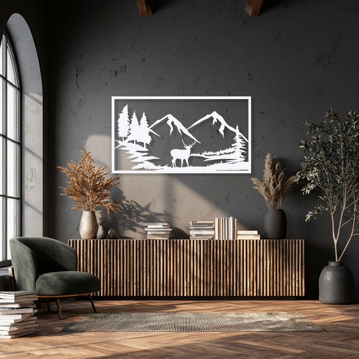 The stillness of a serene mountain landscape featuring a majestic deer silhouette is captured in this unique metal wall art.