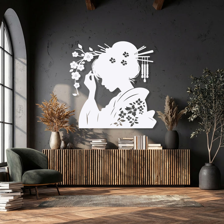 The negative space, formed by the dark wall, distinctly outlines the elegant white geisha oriental silhouette, a stunning decorative metal art piece.