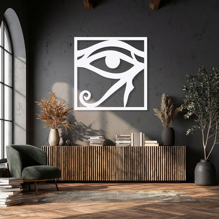 Smooth, clean surface texture of the white Eye of Horus metal artwork, standing out against a textured dark wall.