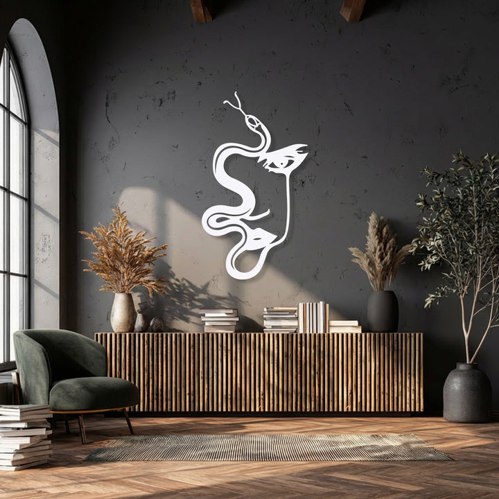 The flowing curves of a unique metal wall art piece depict an abstract woman and serpent silhouette, creating organic forms on a dark wall.