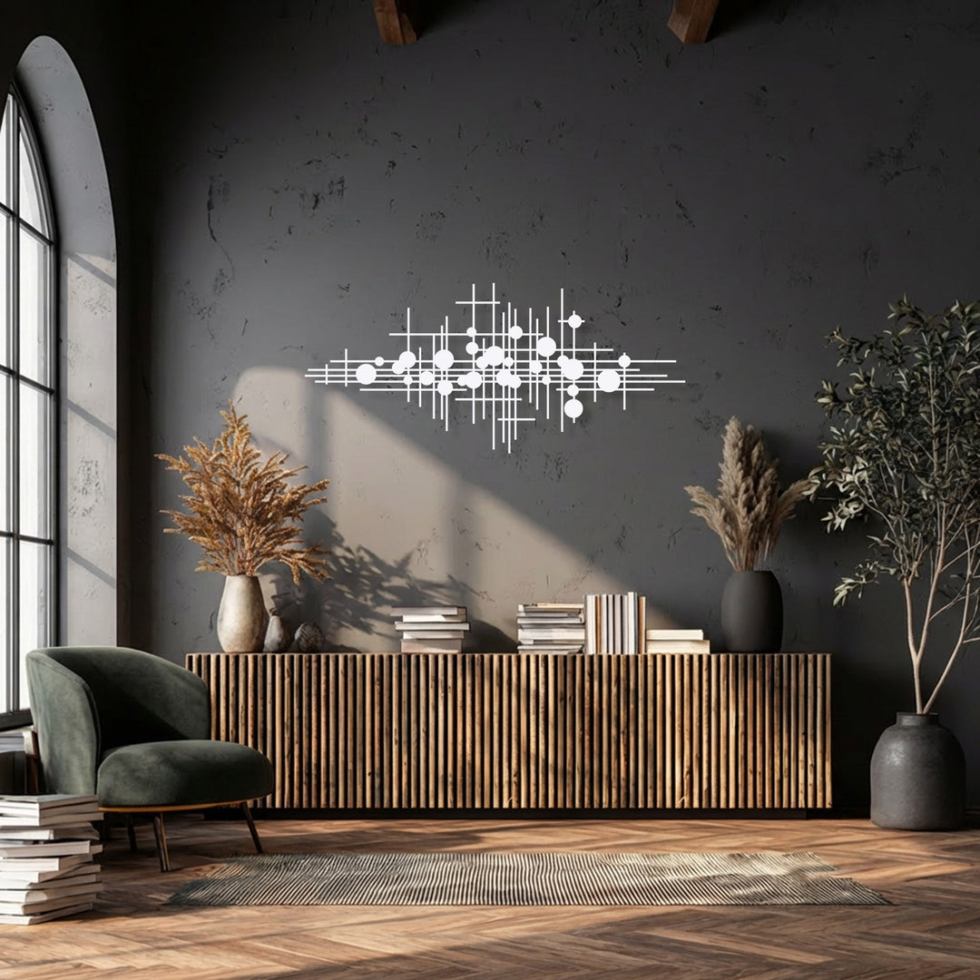 A deep slate grey wall features white geometric lines of decorative metal art, offering a striking abstract modern decor statement.
