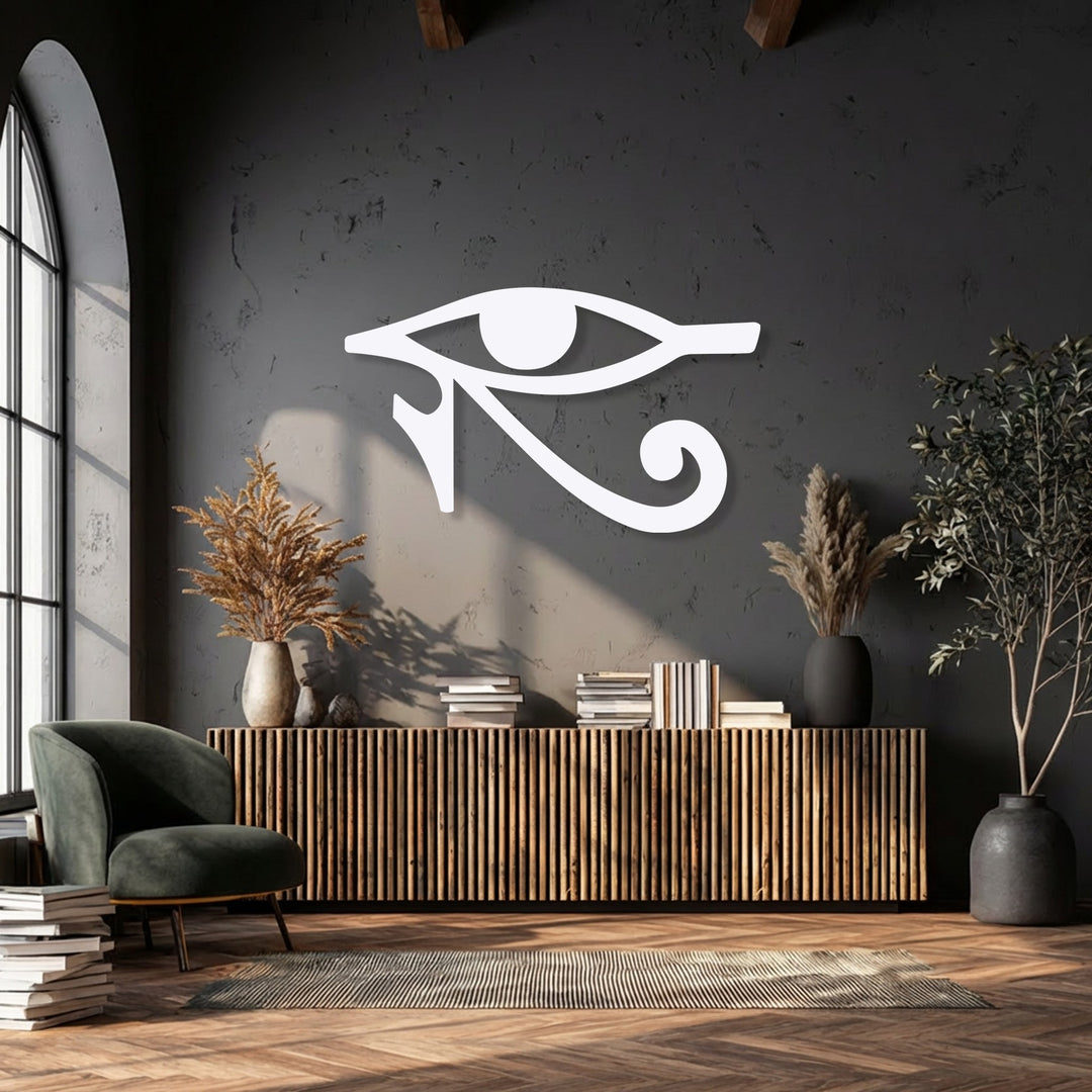 The surrounding negative space crisply outlines the white Eye of Horus metal artwork against a dark wall, emphasizing the Ancient Egyptian Symbol.