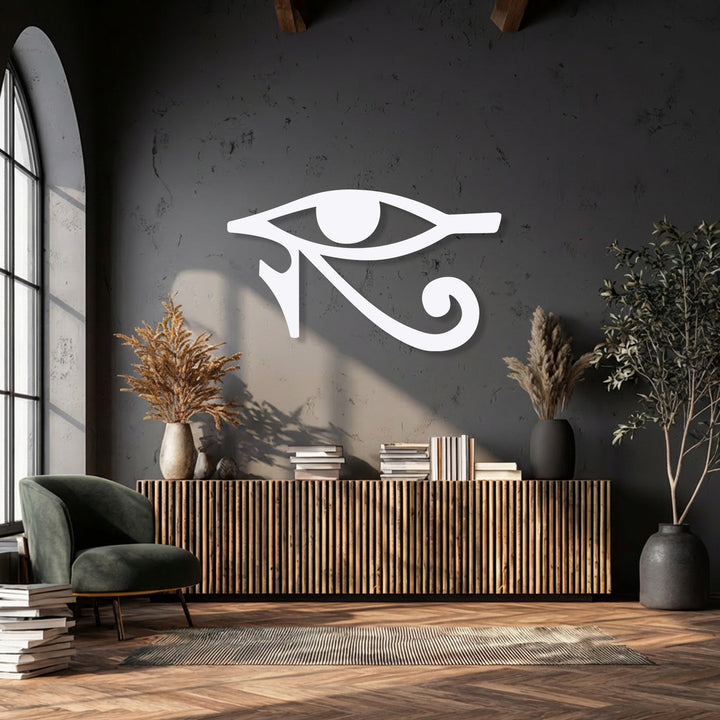 The surrounding negative space crisply outlines the white Eye of Horus metal artwork against a dark wall, emphasizing the Ancient Egyptian Symbol.