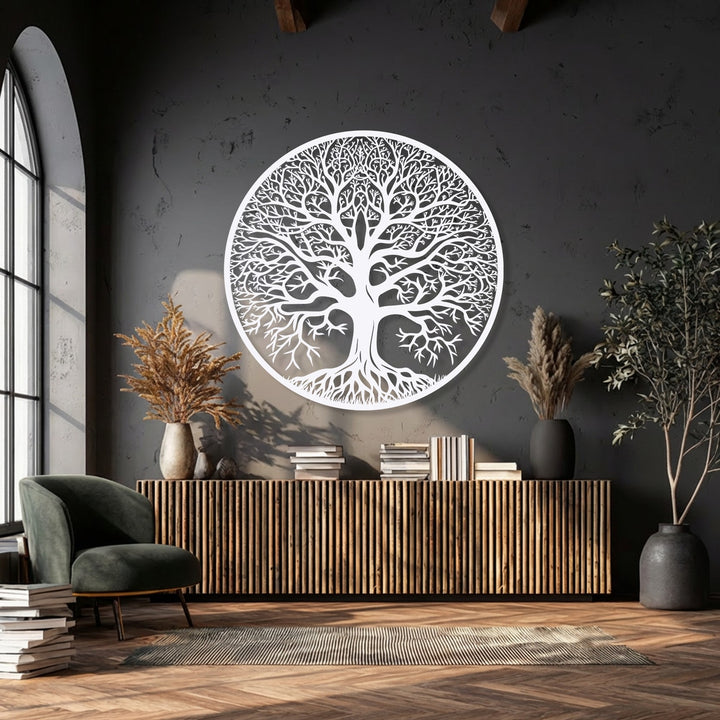 A calm and artistic mood is set by the intricate white Tree of Life circular metal wall decor dominating a dark, elegant space.