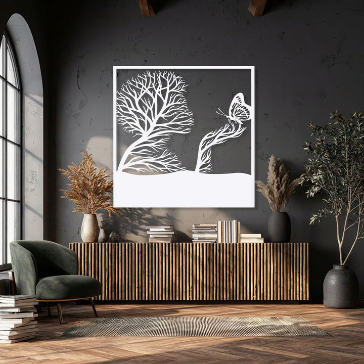 The delicate wings of a butterfly, part of a striking nature-inspired whimsical tree metal artwork, lend softness to the scene.
