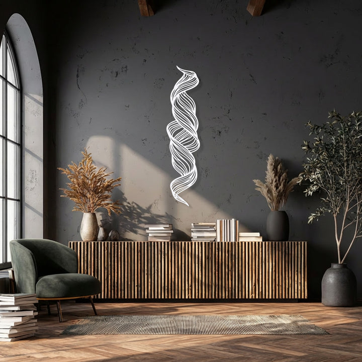 The visual rhythm of the abstract twisted flow decorative metal art creates a dynamic focal point on the dark wall above a cabinet.
