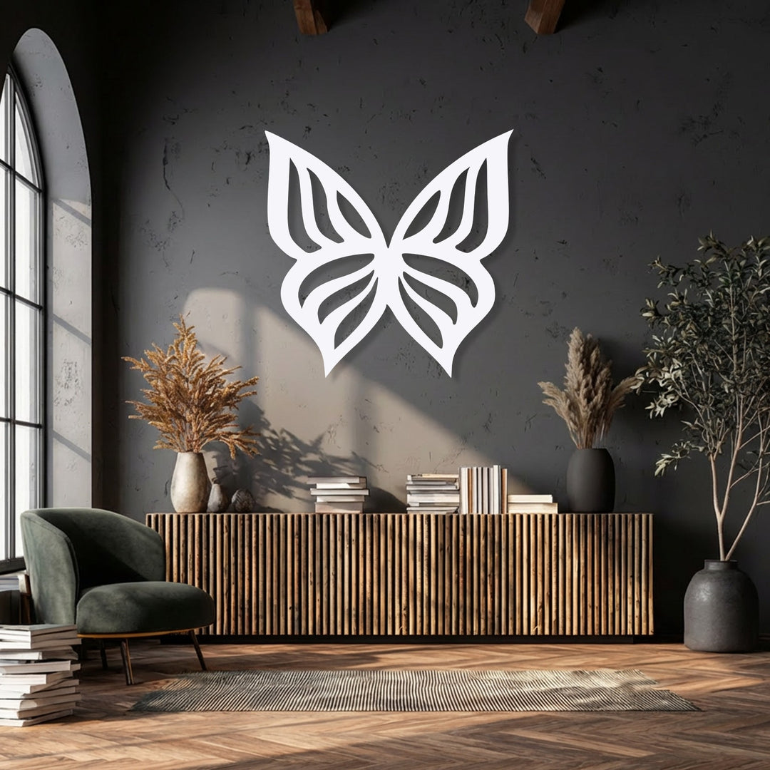 Cool charcoal gray walls are warmed by golden light and natural wood accents, highlighting an elegant butterfly silhouette metal artwork.
