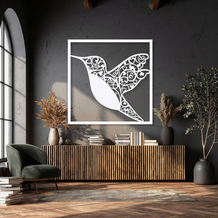 Warm color temperature dominates this scene, with soft window light illuminating wood textures and a striking hummingbird heart metal art for wall.
