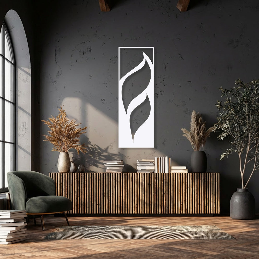 The radiant white minimalist leaf metal artwork gleams against the dark wall, showcasing its elegant flowing design.