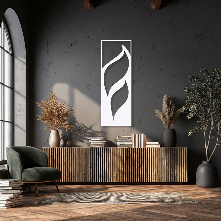 The radiant white minimalist leaf metal artwork gleams against the dark wall, showcasing its elegant flowing design.