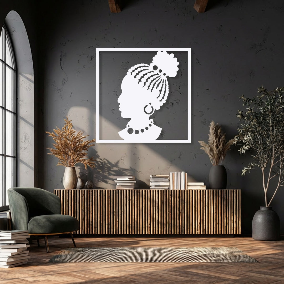 Dark charcoal walls highlight a striking white elegant African woman silhouette metal wall decor piece, showcasing cultural design.