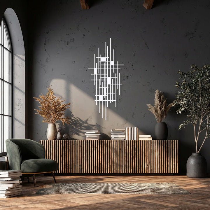 The subdued color saturation highlights the crisp white lines of the modern geometric grid decorative metal art, contrasted against the deep gray wall.