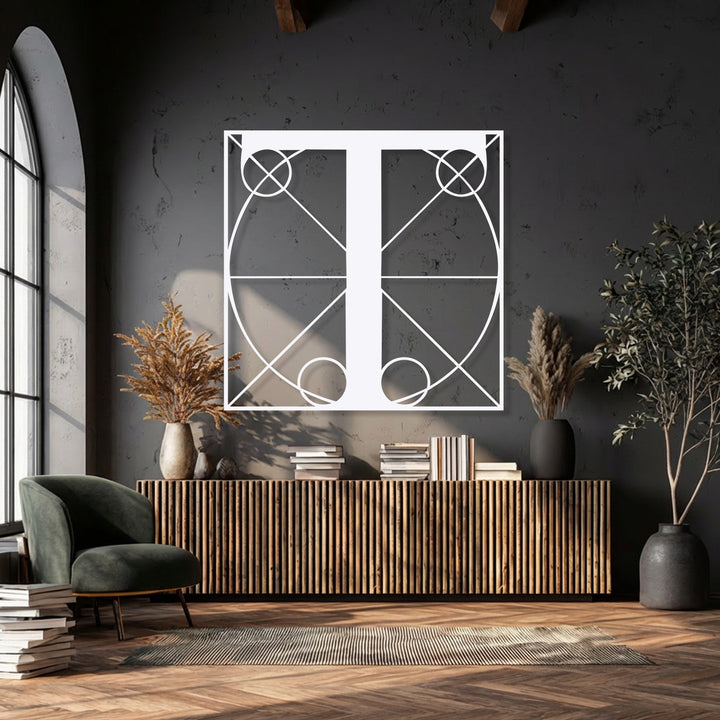Vertically oriented, this rectangular piece of geometric letter T metal wall decor features intricate lines, circles, and a central monogram design.