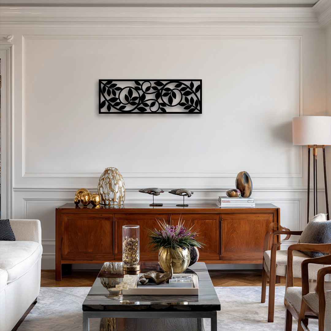 The visual rhythm created by the flowing botanical vine pattern of the modern decorative metal art panel adds a graceful movement to the wall.