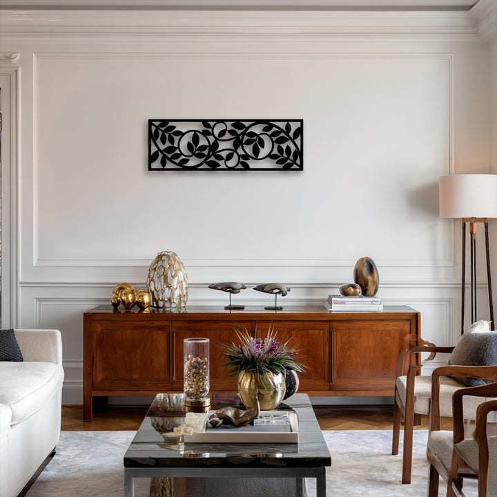 The visual rhythm created by the flowing botanical vine pattern of the modern decorative metal art panel adds a graceful movement to the wall.