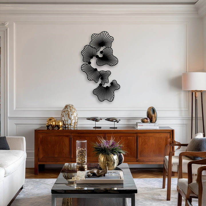 Layers of intricately designed abstract floral metal wall decor create stunning depth against the pristine white wall.