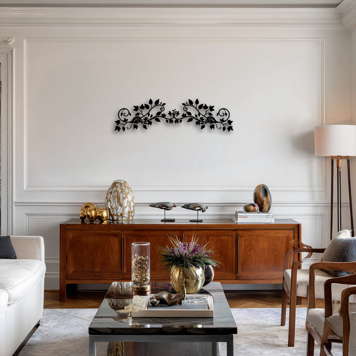The elegant floral vine decorative metal art, featuring an intricate botanical scroll design, serves as the focal point above a rich wooden console.