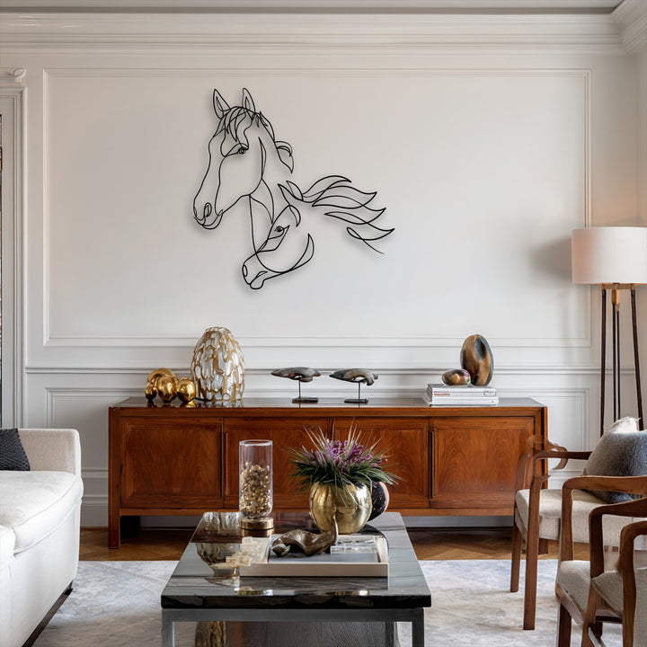 A striking minimalist dual horse line art metal wall decor piece with a flowing design is centered on a white wall.
