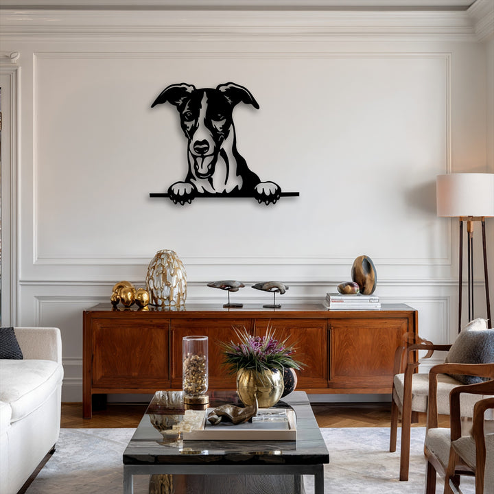 A captivating black metal art piece depicts a curious puppy peeking over a ledge, serving as a playful decorative metal art accent on a white wall.