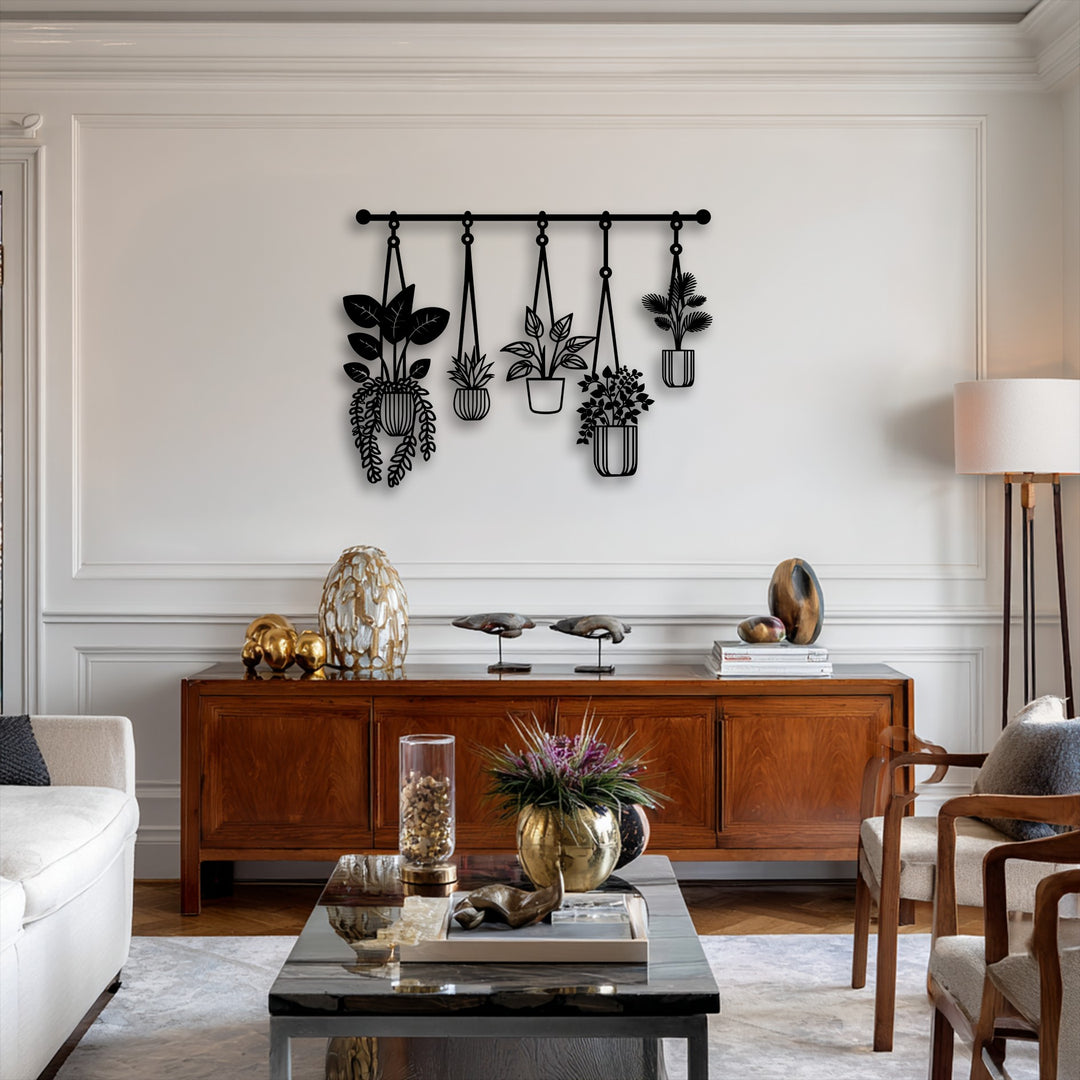 Light and shadow play across the intricate silhouettes of the hanging plants unique metal wall art, casting soft definitions on the pristine white wall.