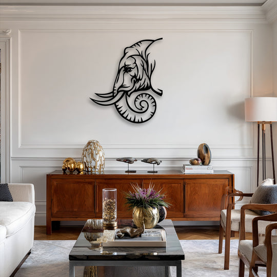 The negative space of the elephant line art metal wall decor highlights its tribal design against a light wall, creating a striking contrast.