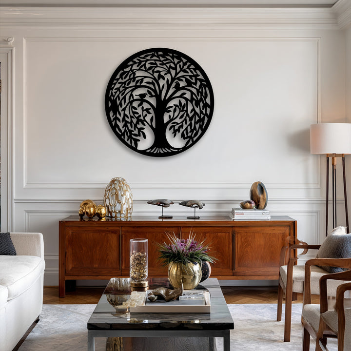 Light-colored paneled walls with elegant crown molding serve as a refined background for the beautiful Tree of Life Round Metal decoration wall art.