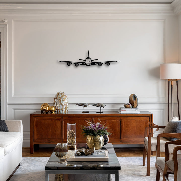 The abstract quality of this unique metal wall art presents an airplane's sleek front view, a minimalist aviation decor.