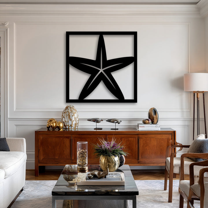 The striking metal artwork features negative space highlighting a modern starfish silhouette within a bold square frame.