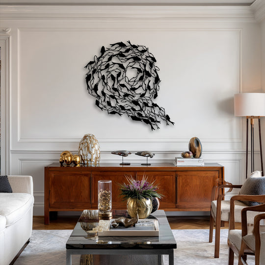 The realistic detail of the intricate black metal koi fish flowing in a captivating circular decoration wall art adorns the white wall.