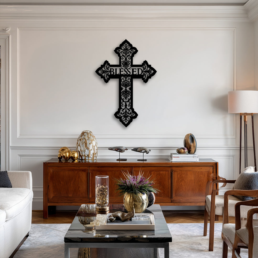 The ornate edges and decorative borders of the Blessed Cross metal art for wall feature intricate black scrollwork against a white background.