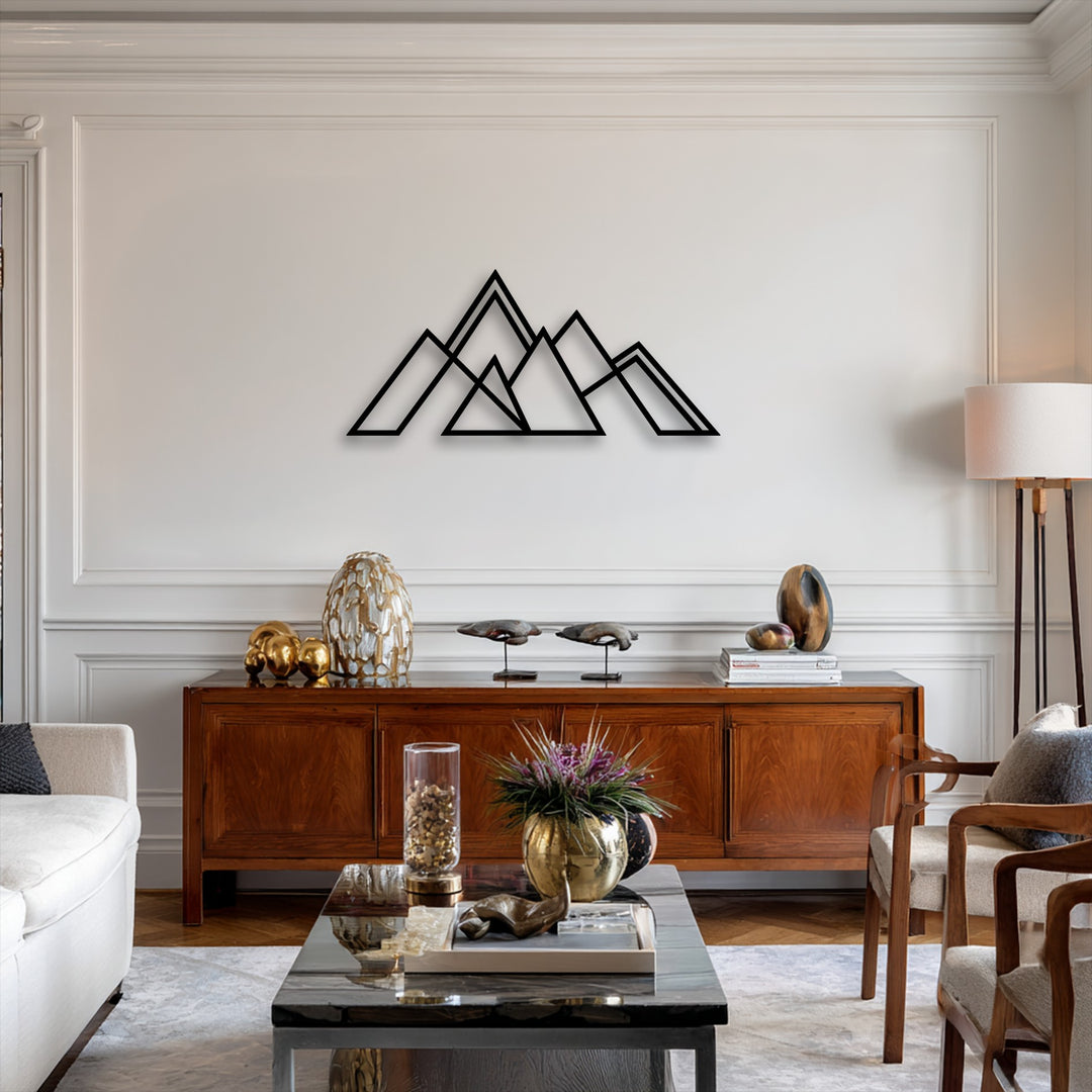 Curvy organic forms of vases and abstract sculptures soften the linear design of the geometric mountain metal decoration wall art.