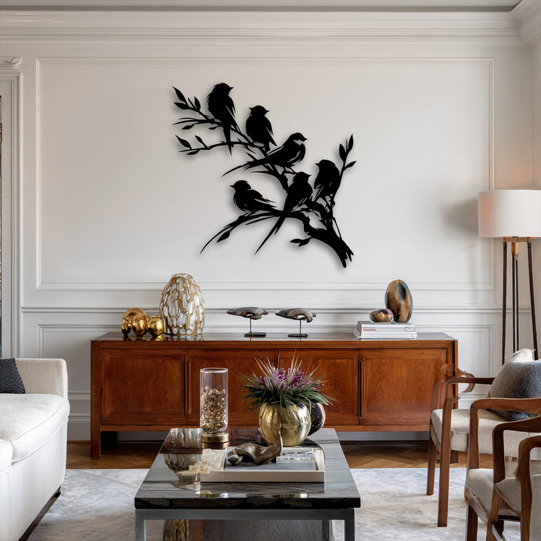 A plush white sofa and soft patterned rug anchor a chic room featuring an exquisite birds on branch metal art for wall silhouette.