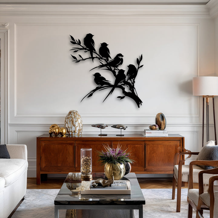 A plush white sofa and soft patterned rug anchor a chic room featuring an exquisite birds on branch metal art for wall silhouette.