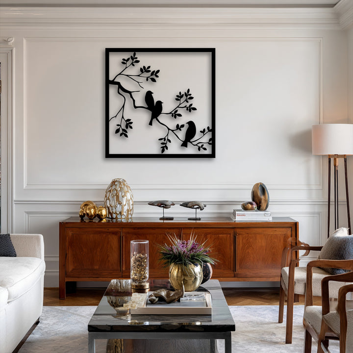 The soft beige armchair cushions provide comfort, harmonizing with the unique birds on branch metal wall art decoration wall art.