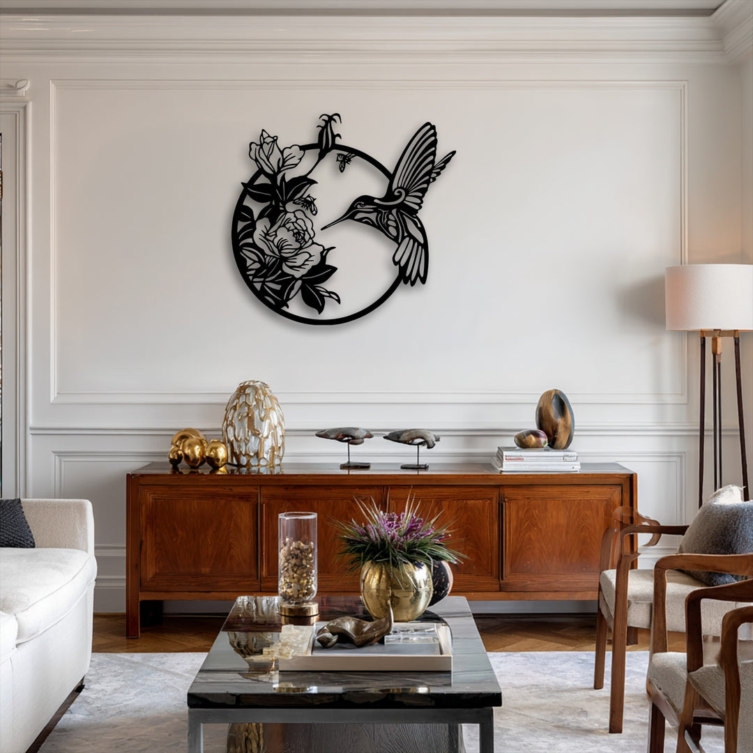 The bright white wall features an elegant metal hummingbird and floral circular decoration wall art.