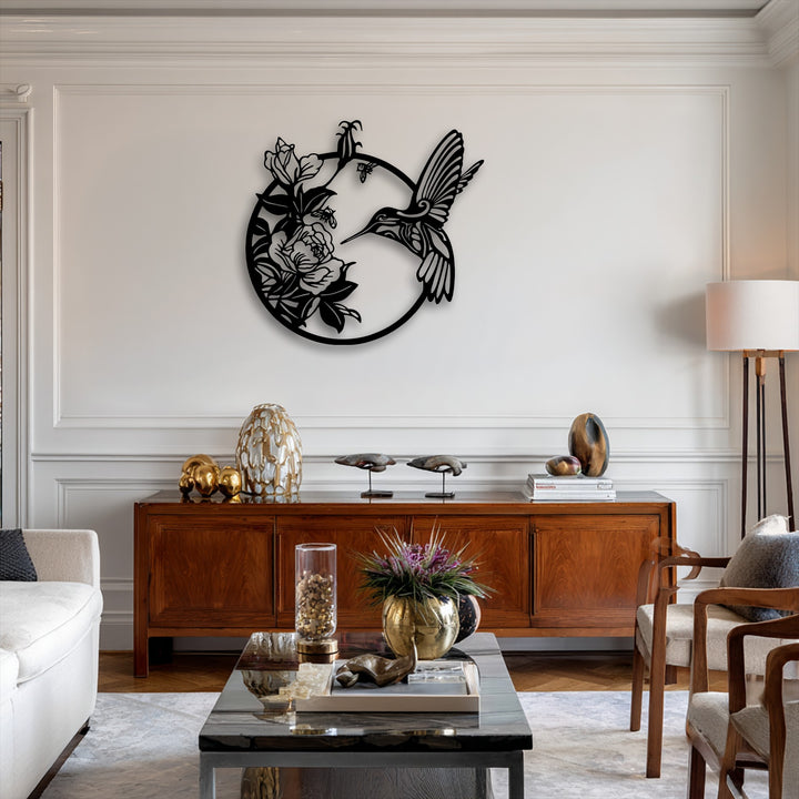 The bright white wall features an elegant metal hummingbird and floral circular decoration wall art.