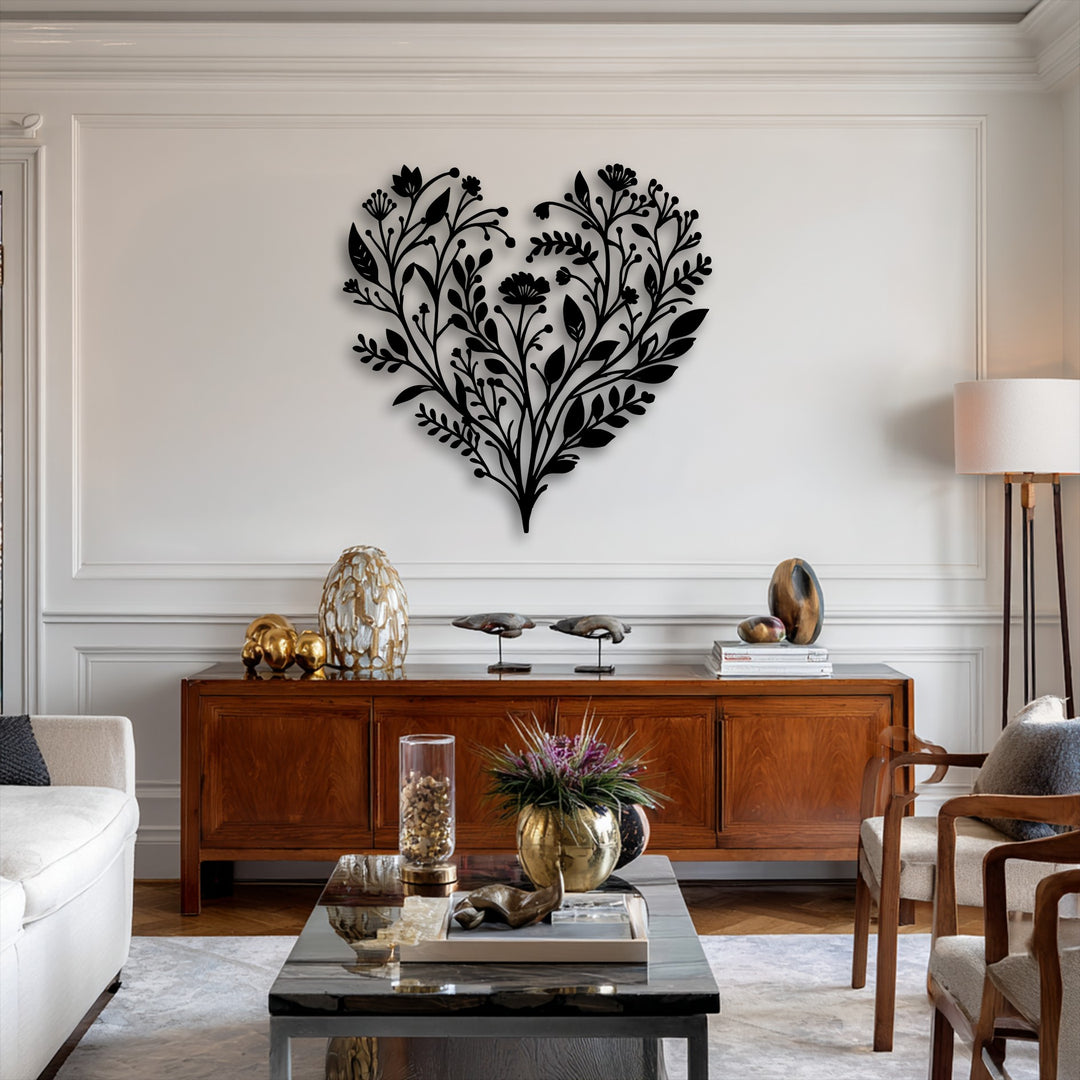 A captivating botanical heart metal wall decor, featuring intricate floral patterns, stands out prominently on a light-colored wall.