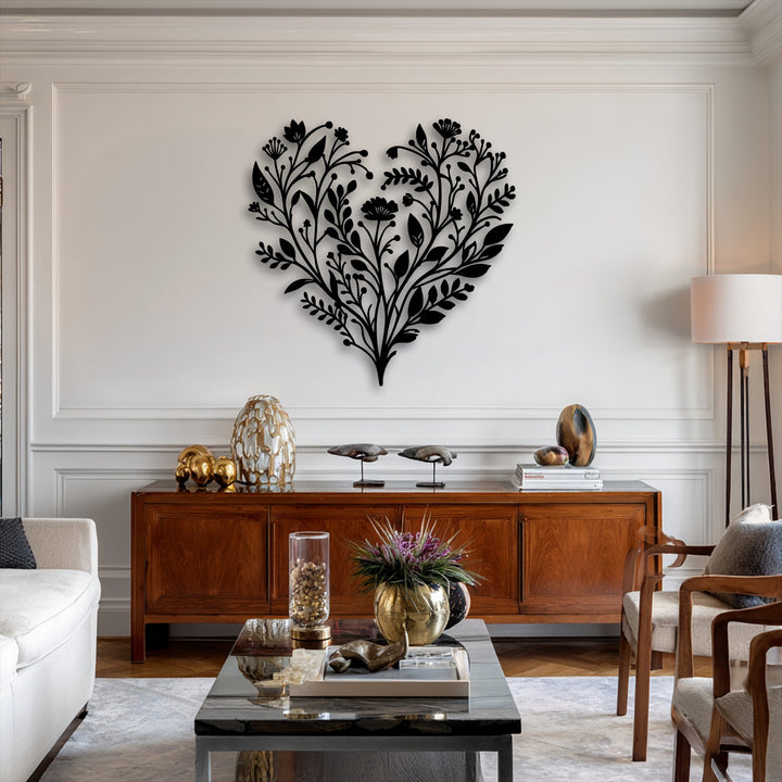A captivating botanical heart metal wall decor, featuring intricate floral patterns, stands out prominently on a light-colored wall.