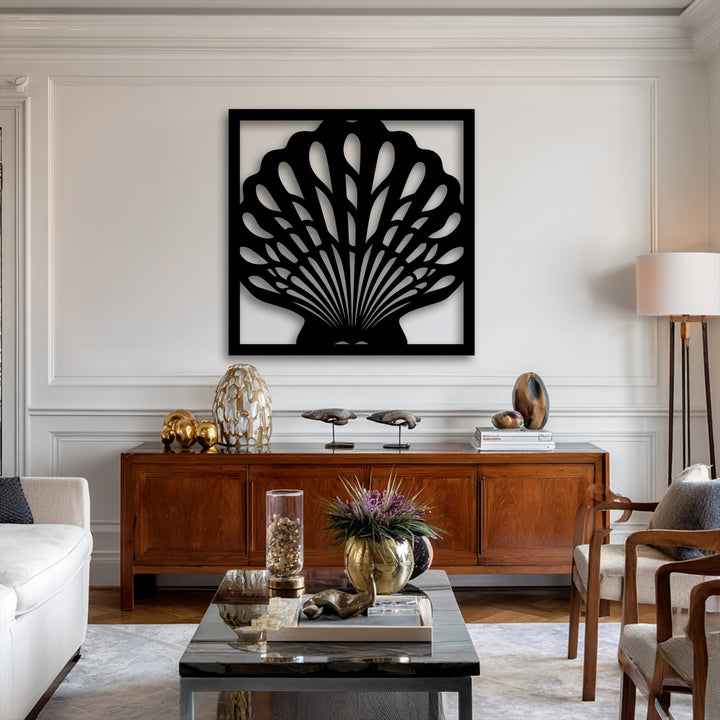 The striking visual rhythm of the black framed seashell metal artwork creates an elegant flow on the white wall.