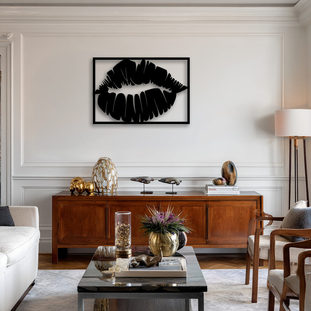 The realistic detail of the bold kiss silhouette is impressively rendered, showcasing a sleek decorative metal art piece above a warm wooden credenza.