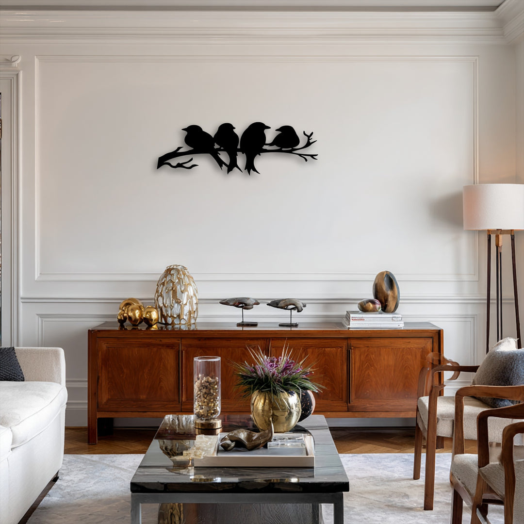 A horizontal silhouette metal art for wall depicts four birds perched on a gracefully flowing branch, offering a tranquil shape.