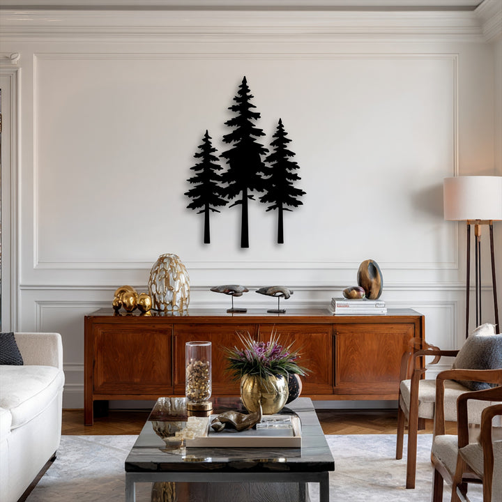 The realistic detail showcases a striking pine forest silhouette metal artwork with three distinct trees against a pristine white wall.