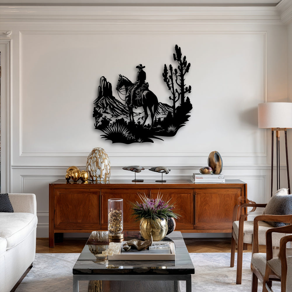 The dynamic black silhouette of a cowboy riding his horse through a rugged desert landscape creates striking metal wall decor.