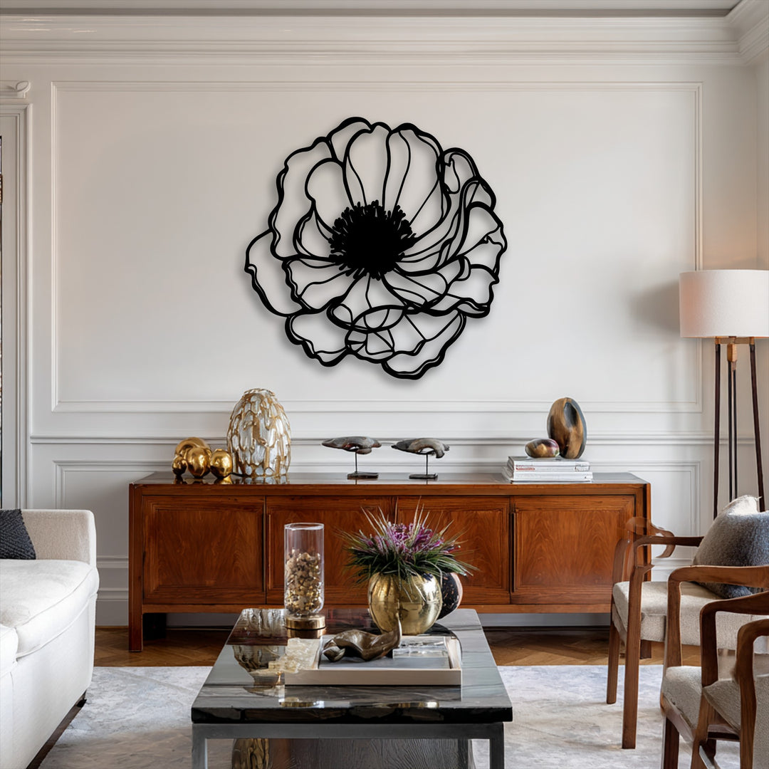 A sleek dark marble coffee table anchors the foreground, beautifully contrasting with the prominent Elegant Bloom Outline decorative metal art.
