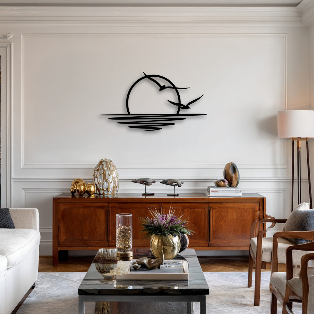 The background features a minimalist sunset and seagull decorative metal art piece against a pristine white paneled wall.