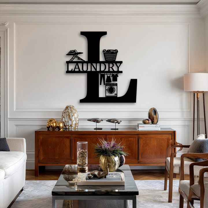 Vertically oriented, this bold black decorative metal art showcases a monogram initial 'L' with integrated laundry designs.