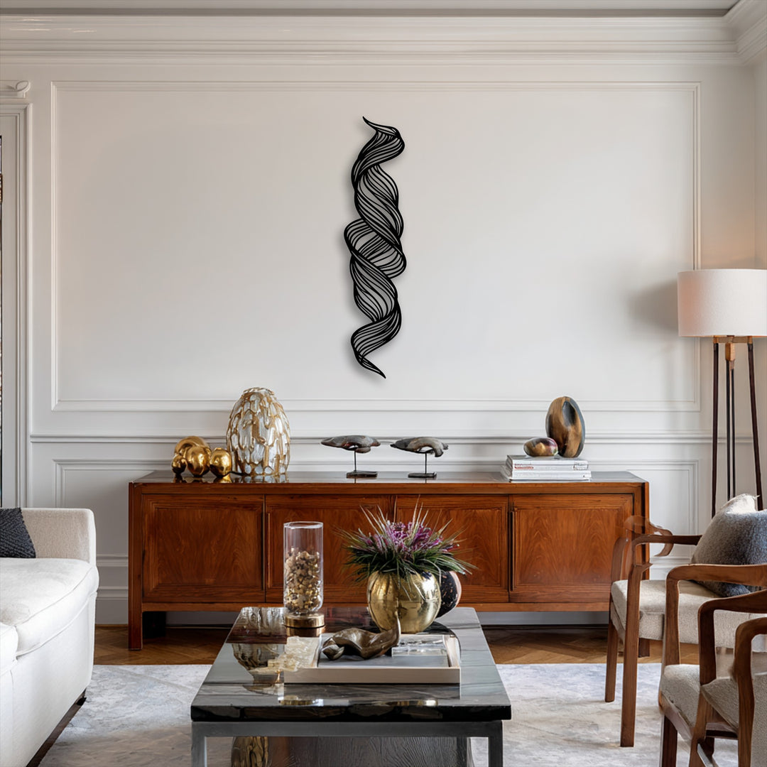 The background is a pristine white wall with classic molding, elegantly contrasting the central abstract twisted flow metal art for wall.